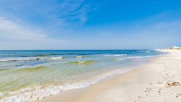 On the beach, sun-loungers