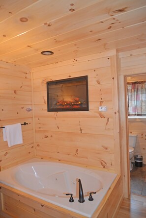 Bathtub, jetted bath, hair dryer, towels