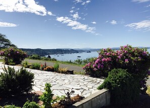 Enjoy serene views of a calm body of water from this peaceful outdoor setting.