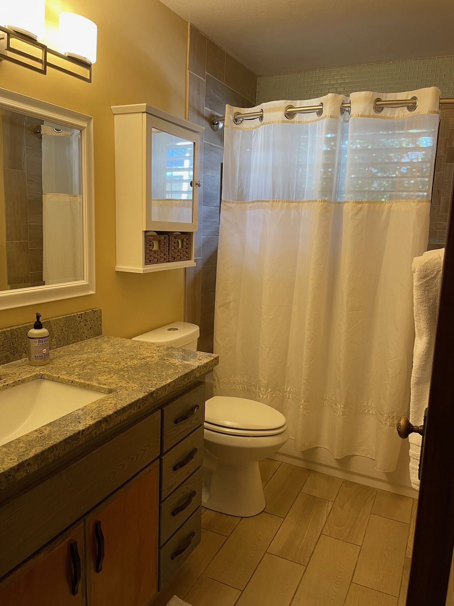 Combined shower/tub, hair dryer, towels, soap