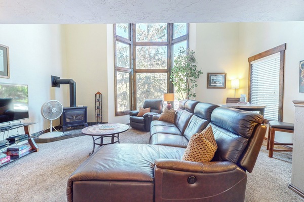 Living Room with plenty of seating, Leather couch, fireplace and TV