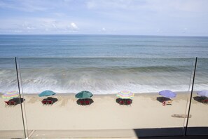 On the beach, sun-loungers, beach towels