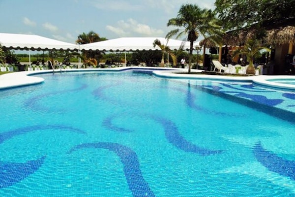 Outdoor pool, open 8:00 AM to 9:00 PM, pool umbrellas, sun loungers