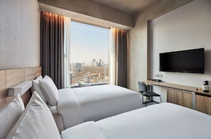 Premium bedding, down comforters, pillowtop beds, in-room safe