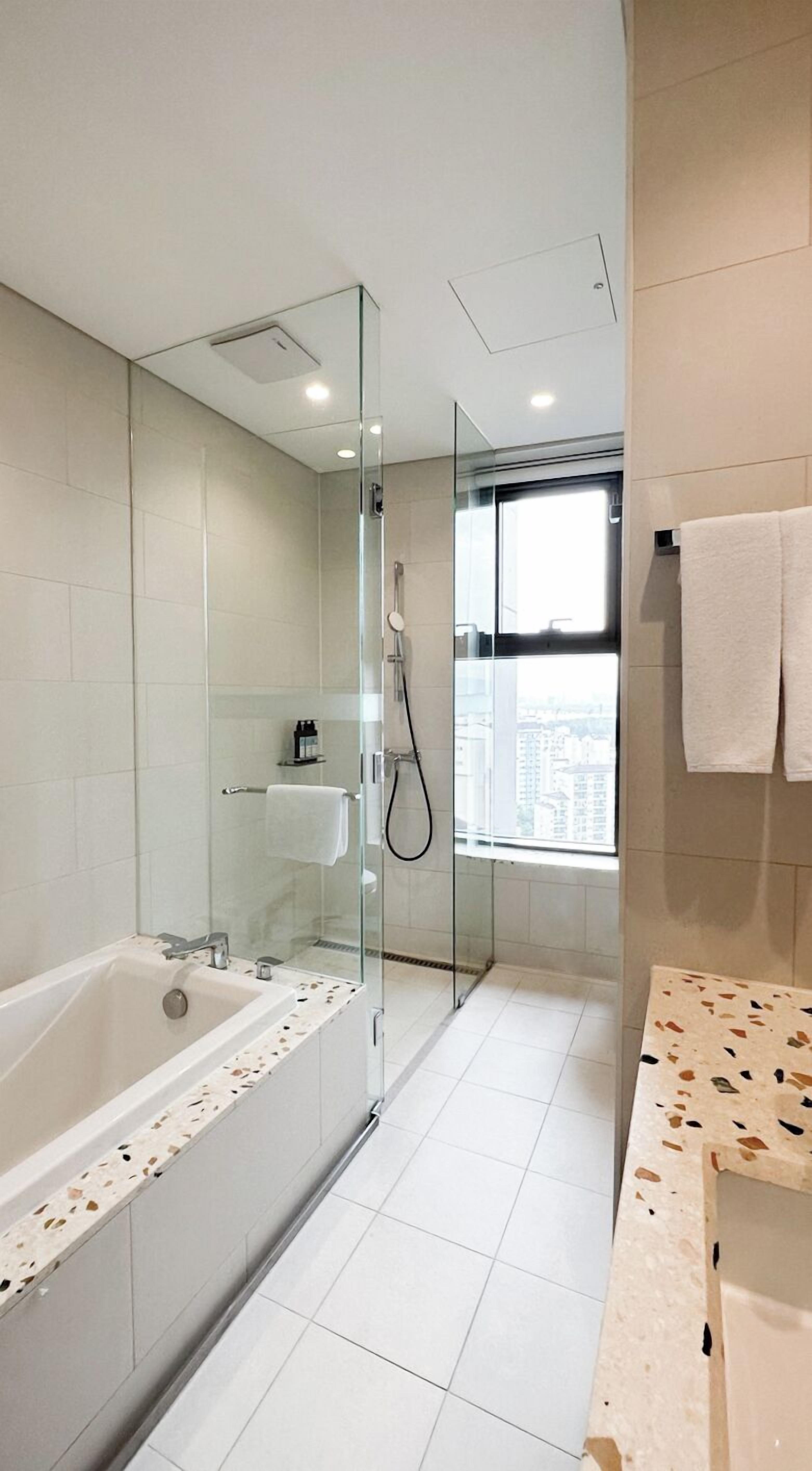 shower, hair dryer, bathrobes, slippers