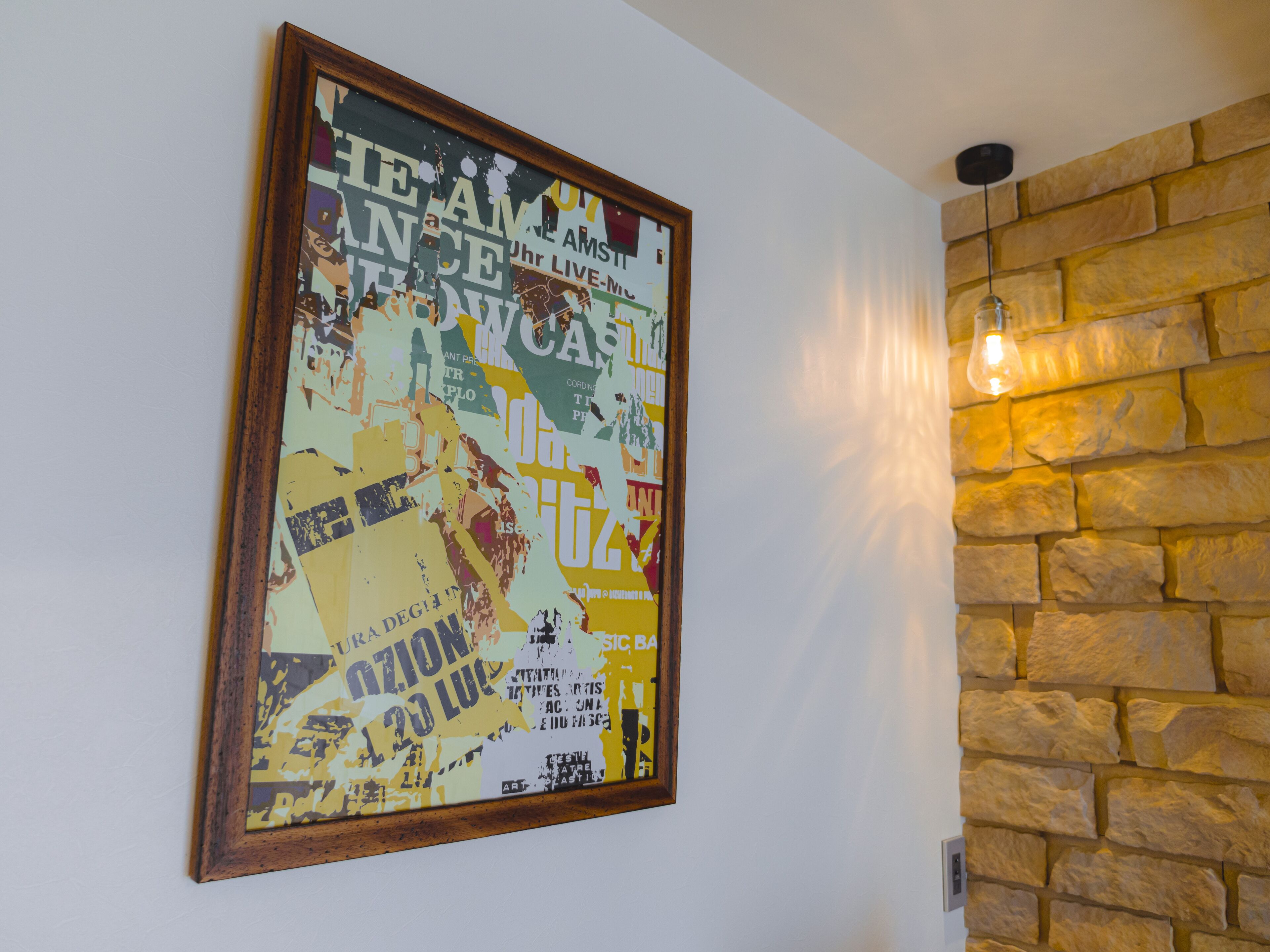 A framed poster with text and graphics on a wall.