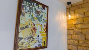 A framed poster with text and graphics on a wall.