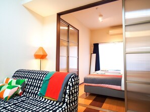 Apartment | Living area | Flat-screen TV - Family Stay DOTONBORI III PH72 (Osaka)