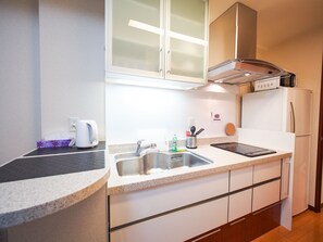 Apartment | Private kitchenette | Fridge, microwave, stovetop, electric kettle - Family Stay DOTONBORI III PH72 (Osaka)