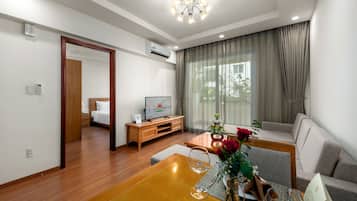 Standard Apartment, 1 Bedroom | Living area | Flat-screen TV