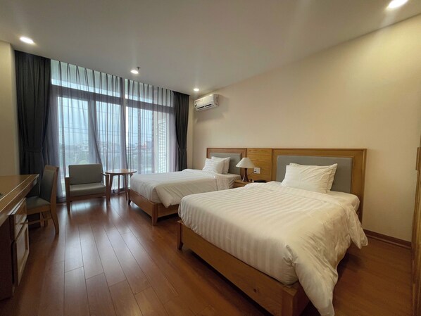 Deluxe Twin Room | Minibar, in-room safe, blackout drapes, iron/ironing board - Sunflower International Village (Hai Phong)