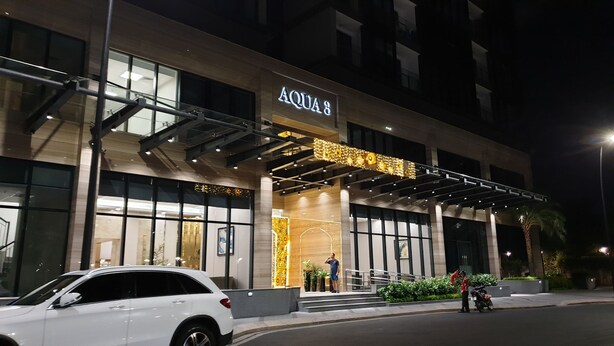 A modern building with a prominent entrance labeled "AQUA 3".