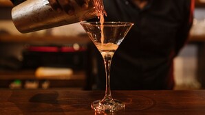 A bartender pouring a drink into a martini glass. - Galway Heights Hotel (Nuwara Eliya)