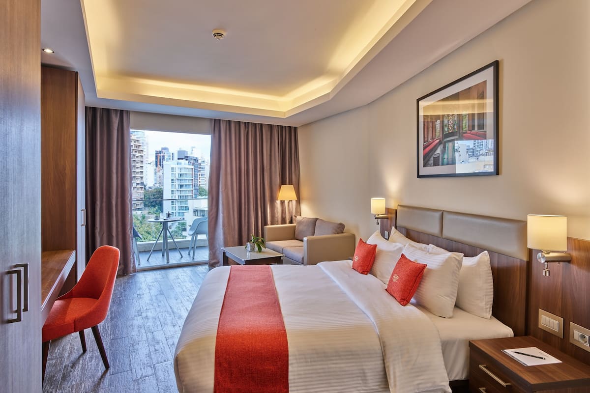 Premium Room with Balcony | 1 bedroom, down comforters, minibar, in-room safe