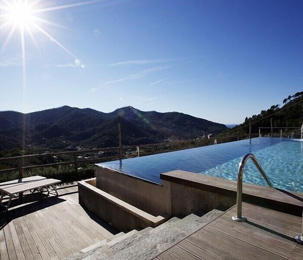 Seasonal outdoor pool, open 9:30 AM to 8:00 PM, sun loungers