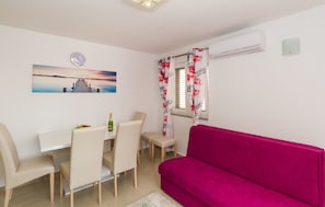 Apartment, City View | Living area | Flat-screen TV