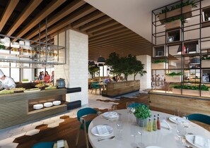 A modern restaurant interior with a chef preparing food, a buffet area, and a seating area with tables set for dining. - Millennium AL Barsha (Dubai)