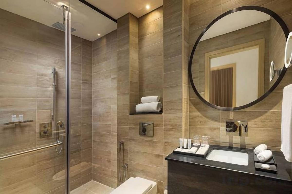 Bathroom | Rainfall showerhead, bathrobes, bidet, towels