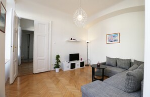 Classic Apartment | Living room | 81-cm flat-screen TV with satellite channels, LCD TV