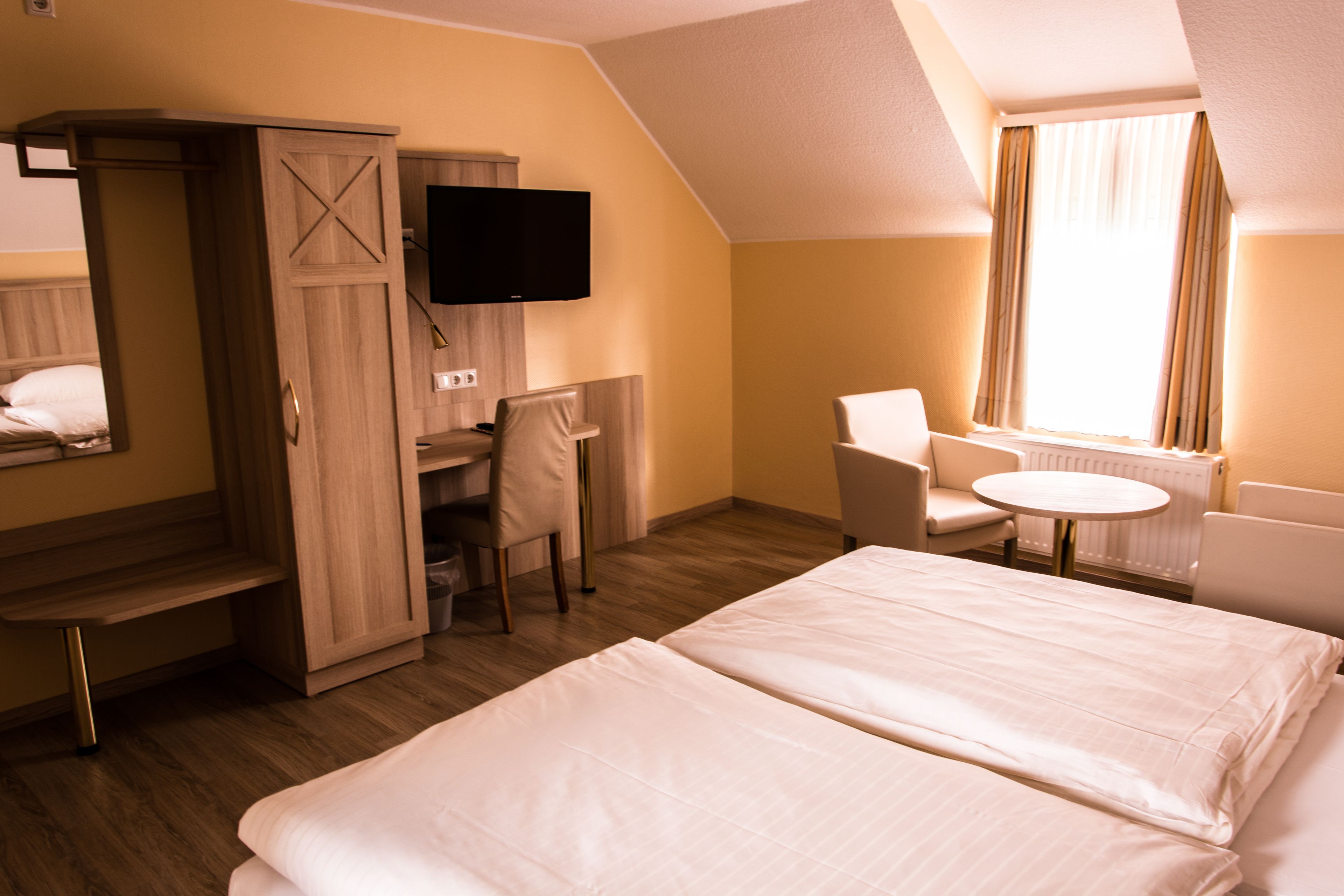 hypo-allergenic bedding, desk, blackout curtains, cots/infant beds