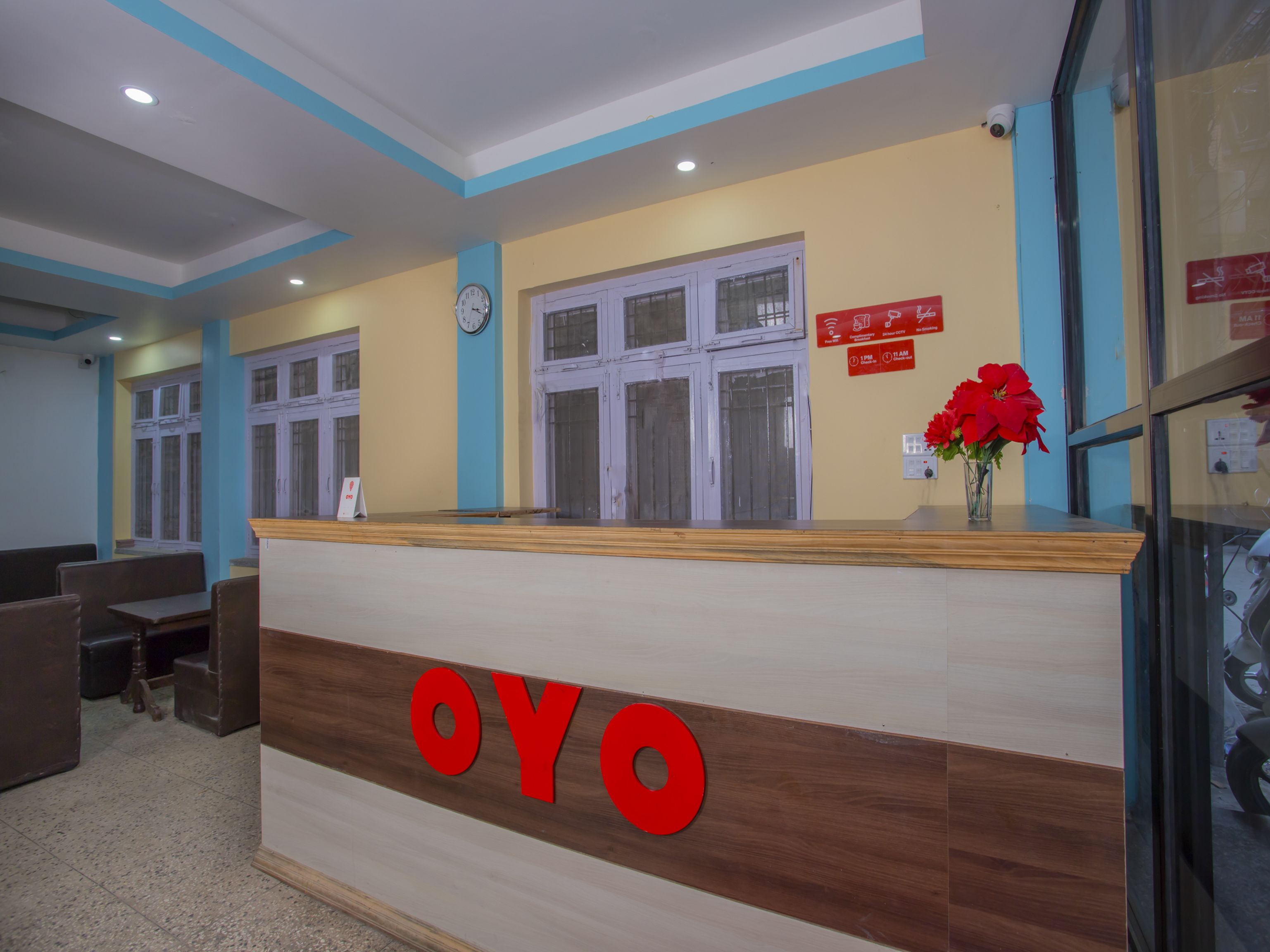 A reception desk with the name "OYO" prominently displayed.