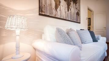 Apartment, 1 Bedroom | Living room | 30-inch flat-screen TV with digital channels, TV