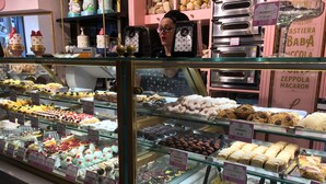 A bakery display case with various pastries and desserts. - Boutique Toledo (Naples)