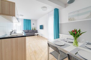Quadruple Room, Kitchenette | Laptop workspace, blackout drapes, iron/ironing board, free WiFi