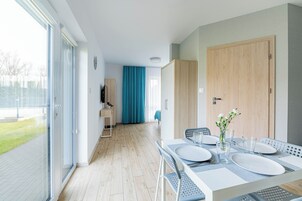 Quadruple Room, Kitchenette | Laptop workspace, blackout drapes, iron/ironing board, free WiFi