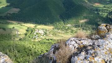 A mountainous landscape with a village nestled in the valley.