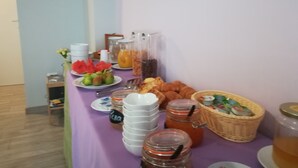 A breakfast buffet with various food items and beverages. - Leolù Guesthouse and breakfast (Alghero)