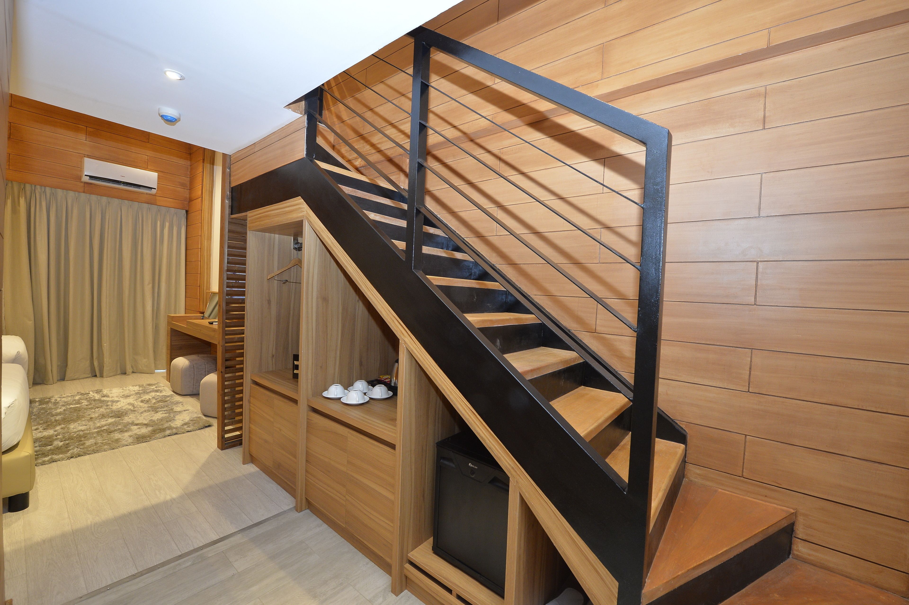 white loft room | minibar, in-room safe, desk, blackout curtains