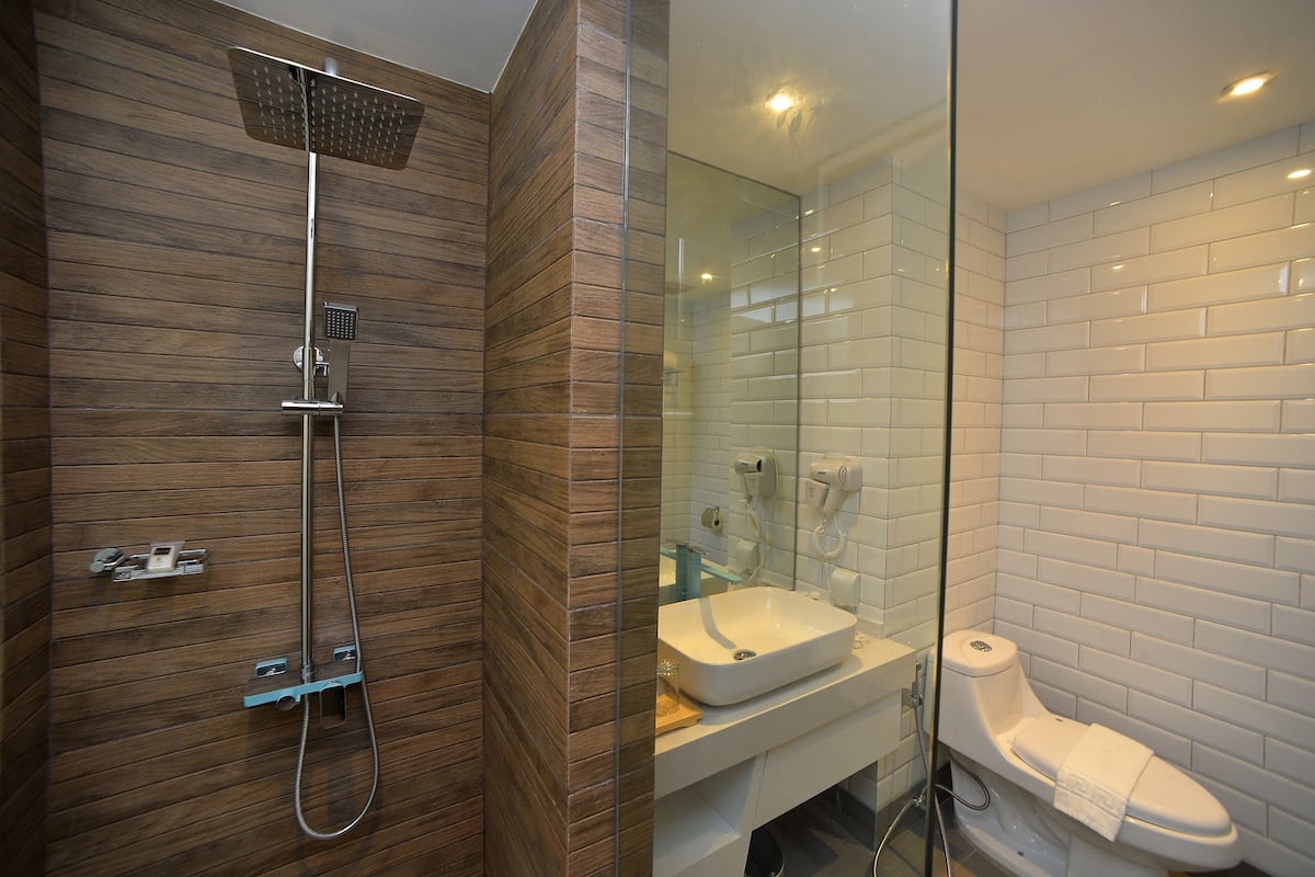 premiere room | bathroom | shower, free toiletries, hair dryer, bathrobes