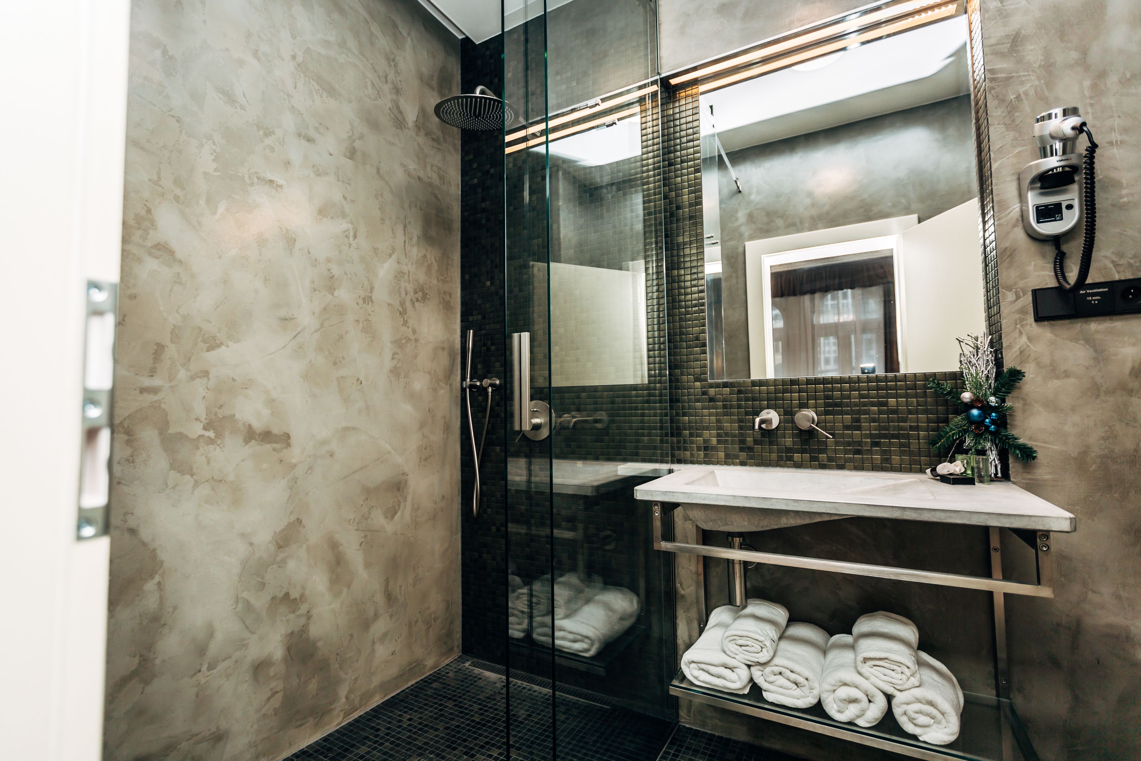 shower, hair dryer, slippers, towels