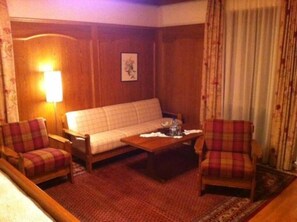 Triple Room | Living area | TV
