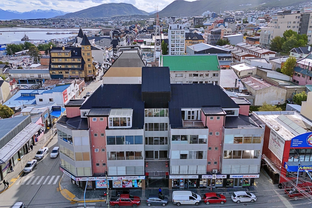 A multi-story building with a central atrium, surrounded by various shops and businesses.