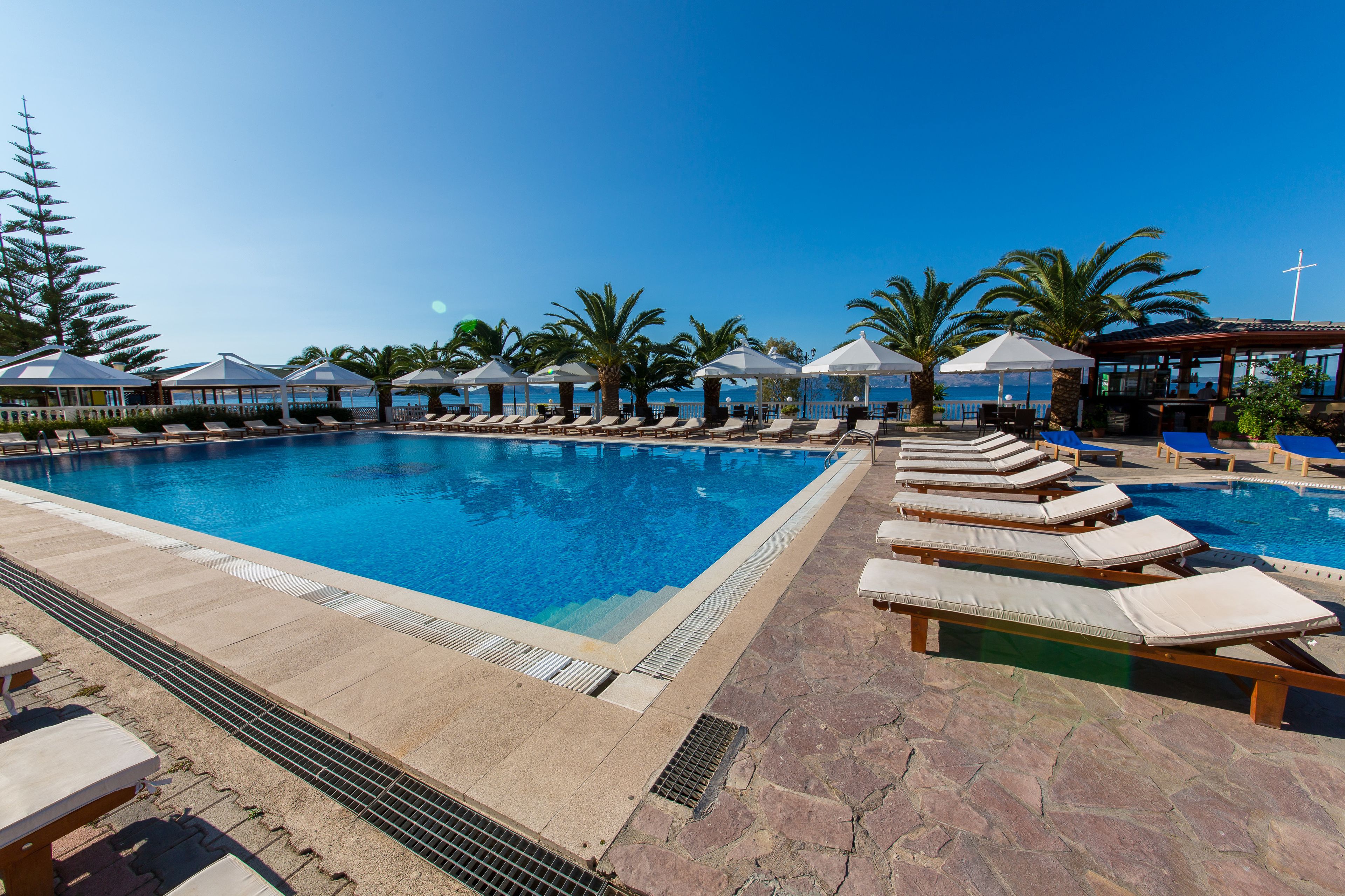 seasonal outdoor pool, pool umbrellas, pool loungers