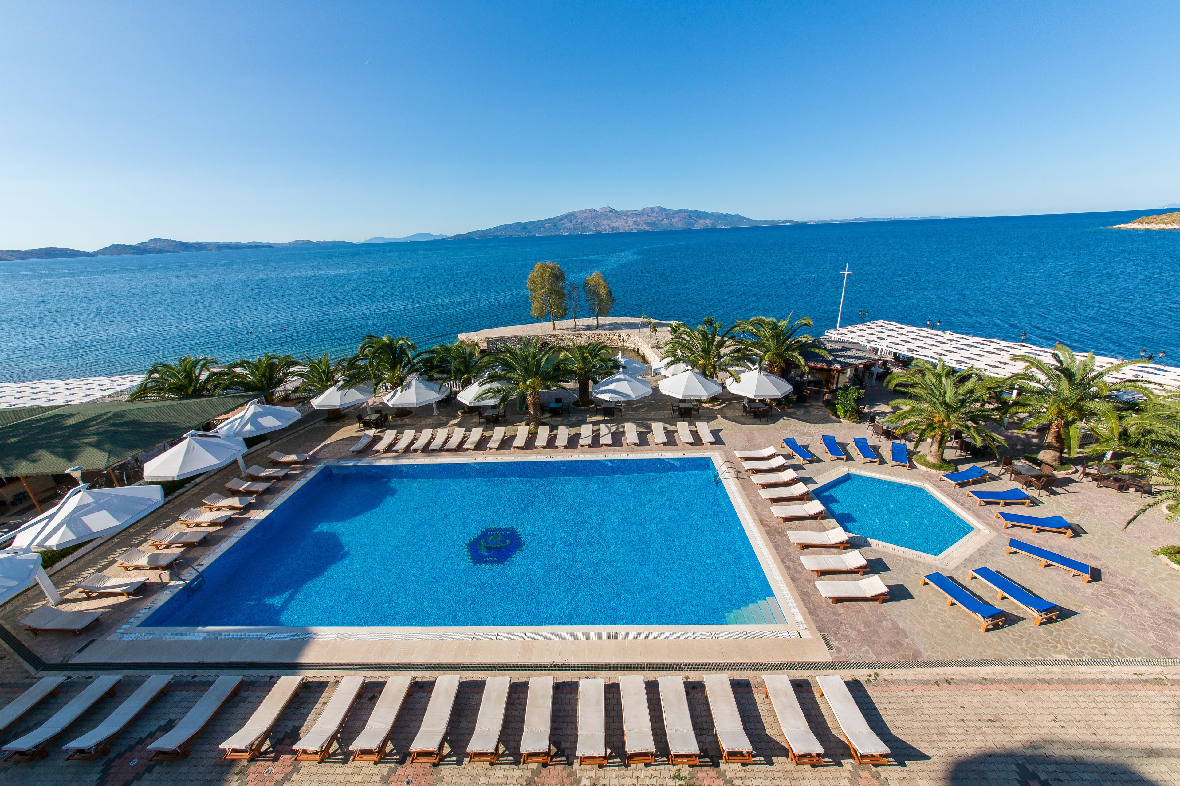 seasonal outdoor pool, pool umbrellas, pool loungers