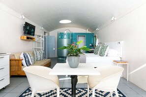 Standard Studio, 1 Bedroom | Living area | Flat-screen TV, DVD player