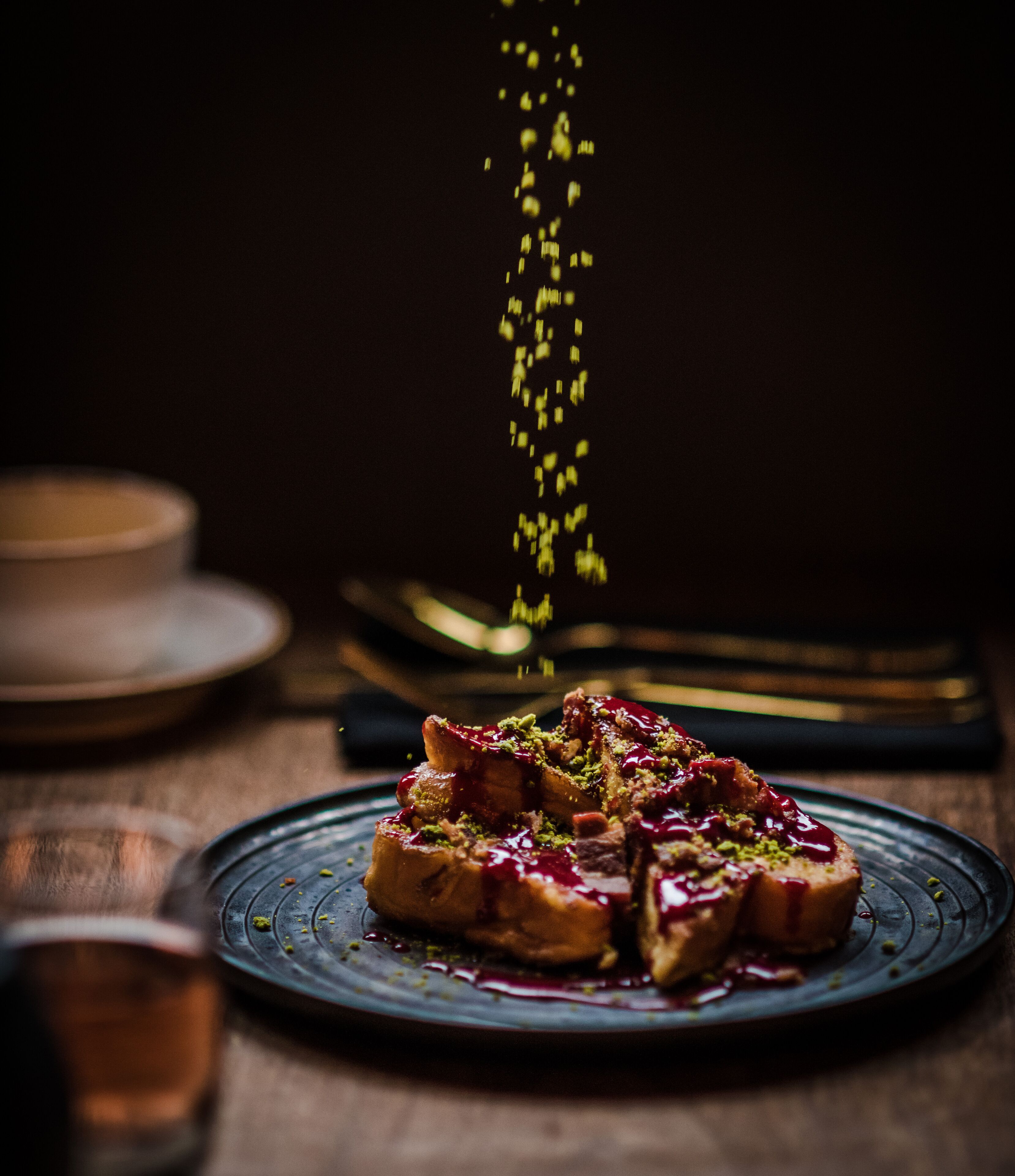 A dessert on a plate with a dark background.