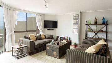 Deluxe Apartment, 3 Bedrooms | Living area | LCD TV