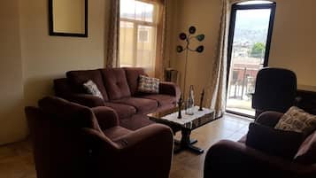 32-inch flat-screen TV with cable channels, LCD TV