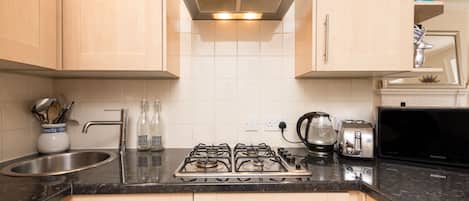 Apartment, 1 King Bed with Sofa bed | Private kitchen | Full-size fridge, microwave, oven, stovetop