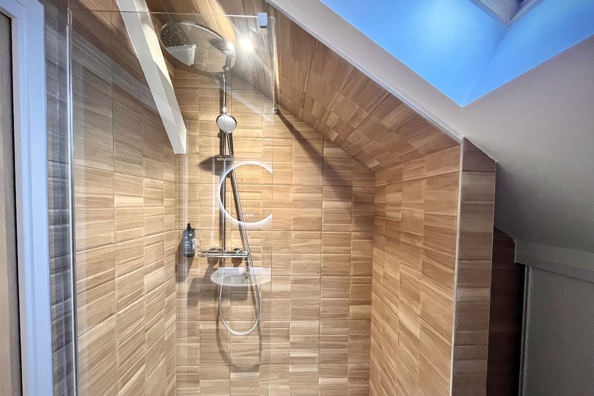 family room | bathroom | separate bathtub and shower, towels, soap, shampoo