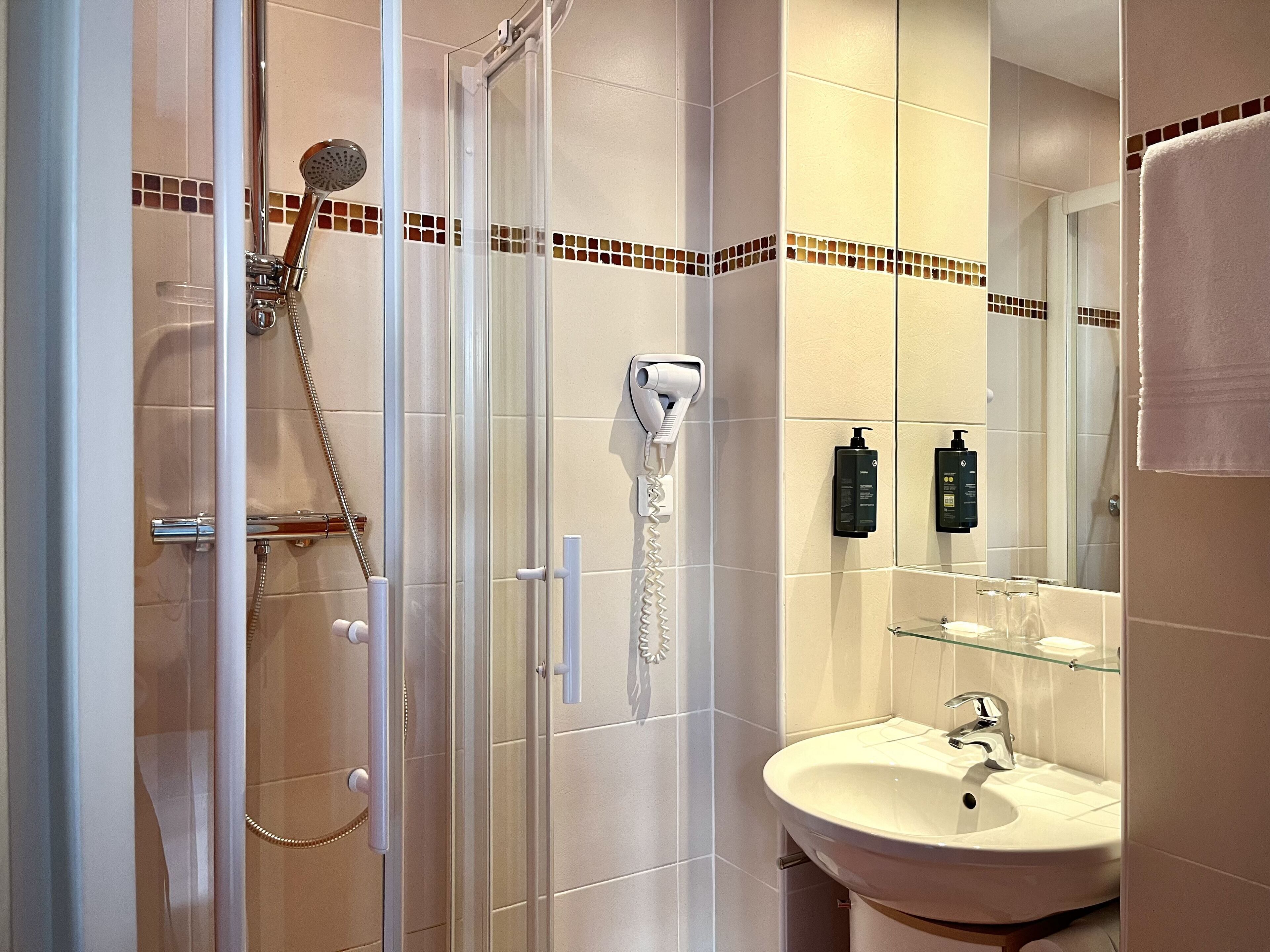 standard single room | bathroom | separate bathtub and shower, towels, soap, shampoo