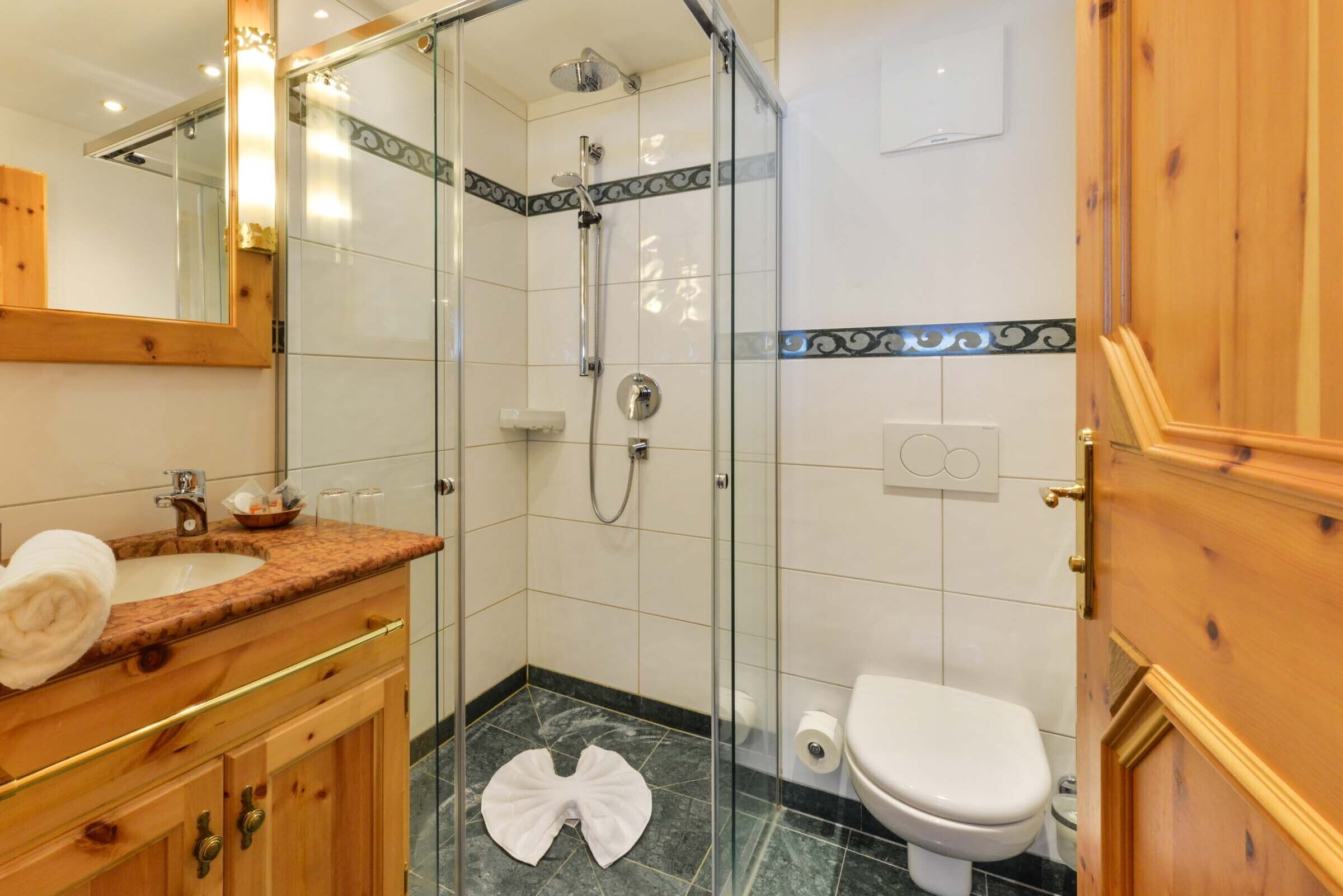 standard double room | bathroom | shower, hair dryer, towels, soap