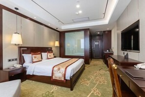 A hotel room with a large bed, bedside tables, a desk, a chair, a television, and a large window. - Jinzun International Hotel (ZAOZHUANG)