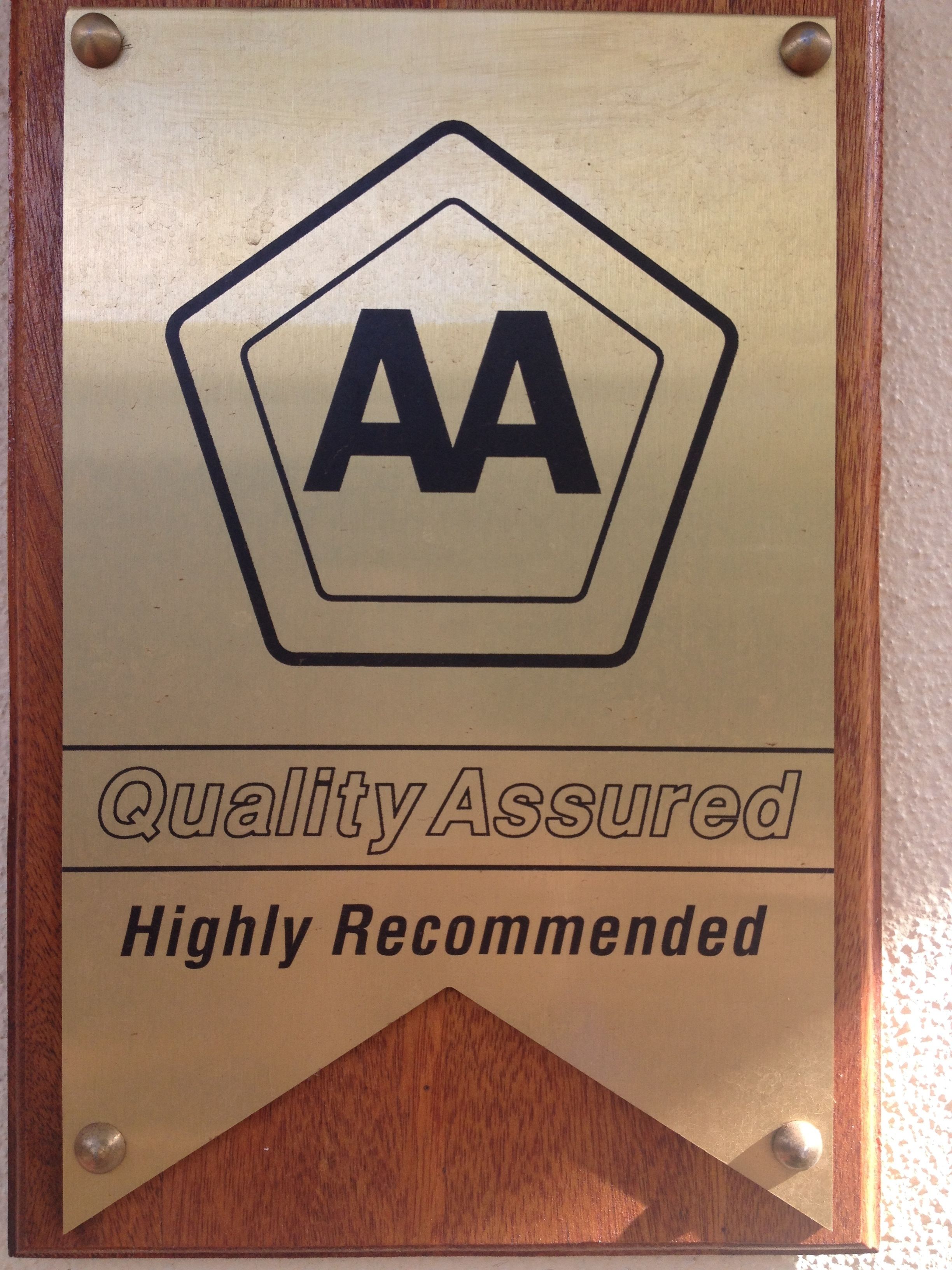 A plaque with the AA logo and the text "Quality Assured" and "Highly Recommended".