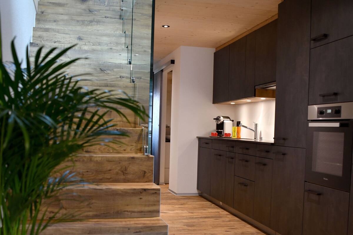 deluxe apartment | living area | flat-screen tv