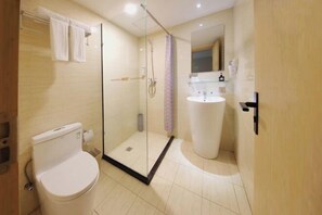 A modern bathroom with a glass-enclosed shower, a toilet, and a sink. - Rest Motel (Xincheng Road) (WENZHOU)